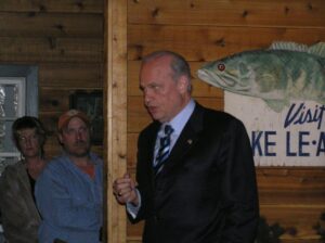 Fred Thompson standing in front of a trout